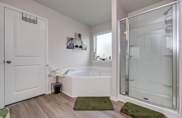 3121 Freeboard Dr, Texas City, TX 77510 - full bathroom featuring wood finished floors, a shower stall, and a bath