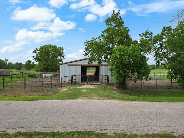 1816 County Road 936b, Alvin, TX 77511 - view of outdoor structure with an exterior structure, an outbuilding, and a view of rural / pastoral area