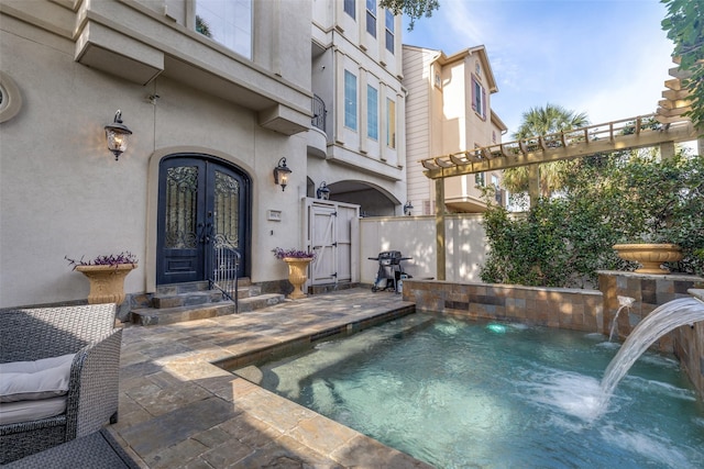 1652 Norfolk St Unit A, Houston, TX 77006 - view of pool with french doors, a patio area, and a fenced backyard