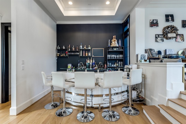 1652 Norfolk St Unit A, Houston, TX 77006 - indoor dry bar featuring wood finished floors, a raised ceiling, recessed lighting, baseboards, and crown molding