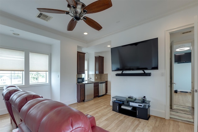 1652 Norfolk St Unit A, Houston, TX 77006 - living area with ceiling fan, ornamental molding, light wood-type flooring, and baseboards