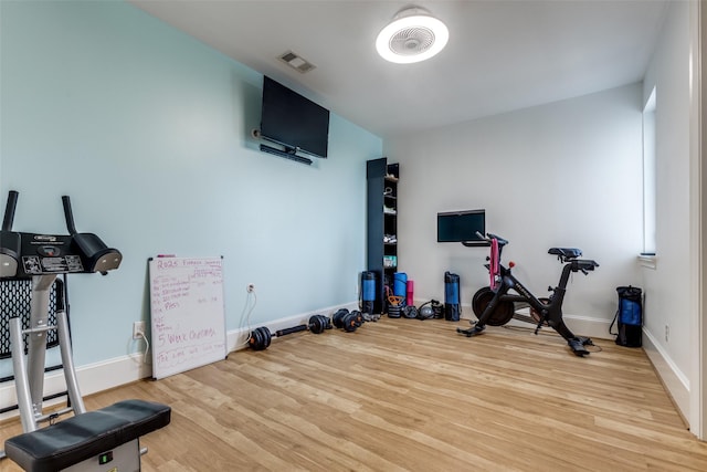 1652 Norfolk St Unit A, Houston, TX 77006 - workout area featuring wood finished floors and baseboards