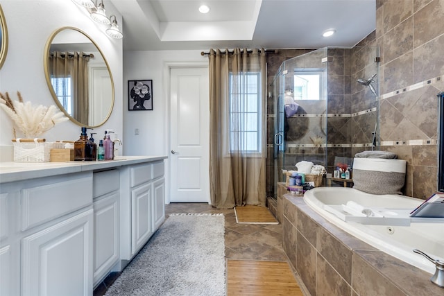 1652 Norfolk St Unit A, Houston, TX 77006 - full bathroom featuring a stall shower, a jetted tub, double vanity, and recessed lighting