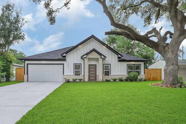 5731 Belvedere St, Houston, TX 77021 - view of front of house with board and batten siding, an attached garage, concrete driveway, and brick siding