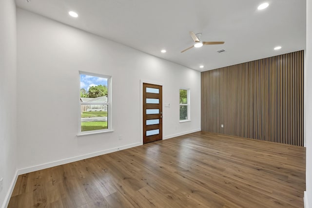 5731 Belvedere St, Houston, TX 77021 - unfurnished room with a ceiling fan, wood finished floors, recessed lighting, and baseboards