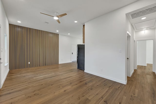 5731 Belvedere St, Houston, TX 77021 - unfurnished room with attic access, a ceiling fan, wood finished floors, recessed lighting, and baseboards