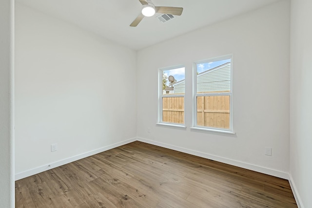 5731 Belvedere St, Houston, TX 77021 - spare room featuring a ceiling fan, baseboards, and wood finished floors