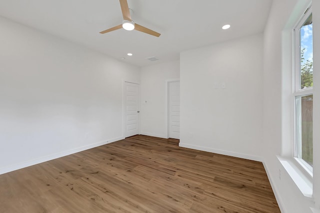 5731 Belvedere St, Houston, TX 77021 - empty room with wood finished floors, a ceiling fan, recessed lighting, and baseboards