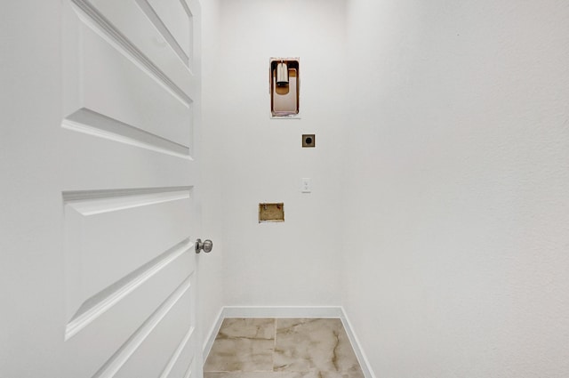 5731 Belvedere St, Houston, TX 77021 - clothes washing area with hookup for an electric dryer, baseboards, washer hookup, and light marble finish floors