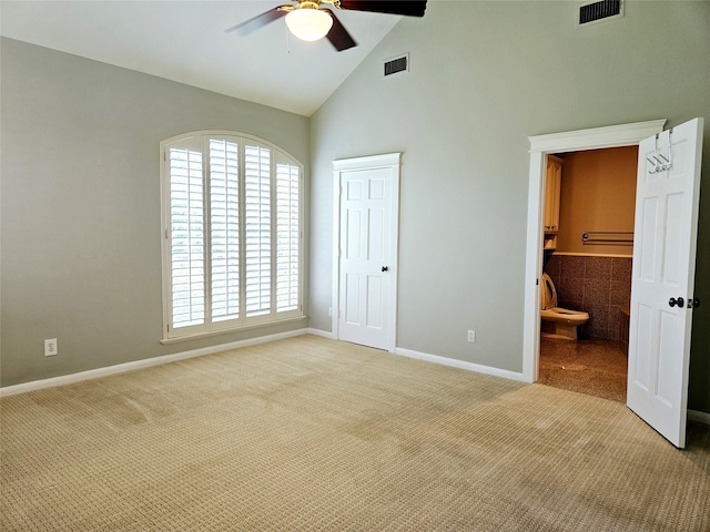 3818 Hazard St, Houston, TX 77098 - unfurnished bedroom featuring high vaulted ceiling, light carpet, baseboards, and ensuite bath