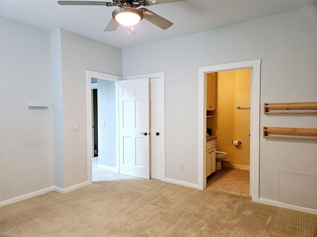 3818 Hazard St, Houston, TX 77098 - unfurnished bedroom with light carpet, ensuite bath, a closet, and a ceiling fan