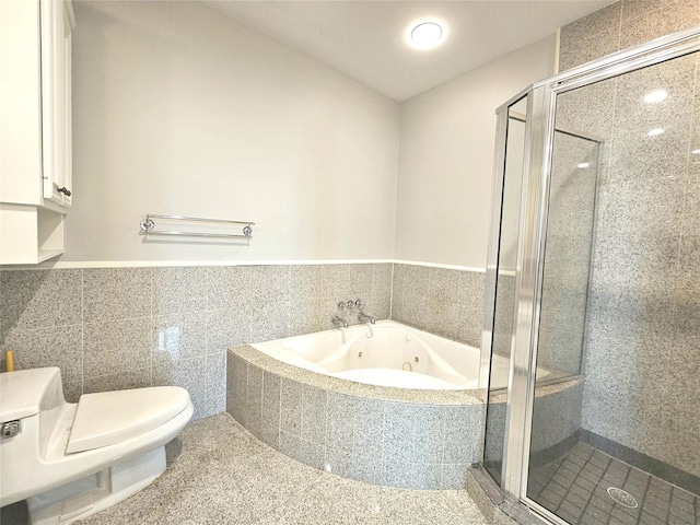 3818 Hazard St, Houston, TX 77098 - full bath featuring a stall shower, a jetted tub, toilet, and wainscoting