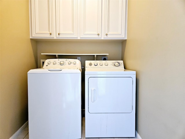 3818 Hazard St, Houston, TX 77098 - clothes washing area featuring cabinet space, washing machine and dryer, and baseboards