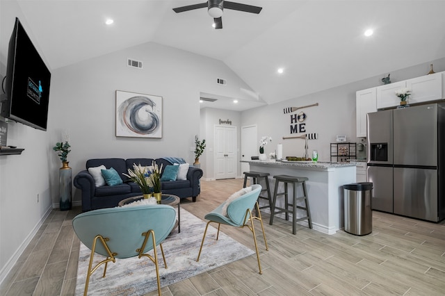 16858 W Alderson, Montgomery, TX 77316 - living area featuring lofted ceiling, light wood finished floors, a ceiling fan, recessed lighting, and baseboards