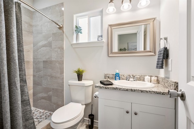 16858 W Alderson, Montgomery, TX 77316 - bathroom with a tile shower, toilet, and vanity