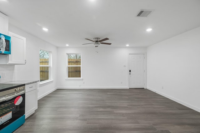 2322 Wavell St, Houston, TX 77088 - kitchen featuring stainless steel electric stove, a ceiling fan, white cabinets, recessed lighting, and dark wood finished floors