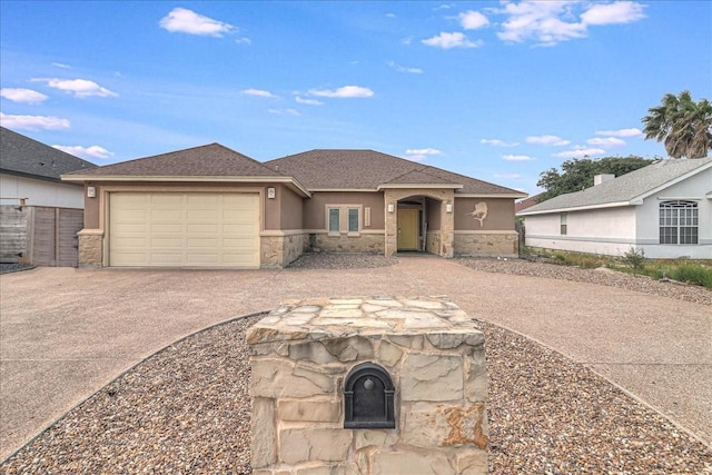 view of front of house with stone siding, concrete driveway, stucco siding, and a garage
