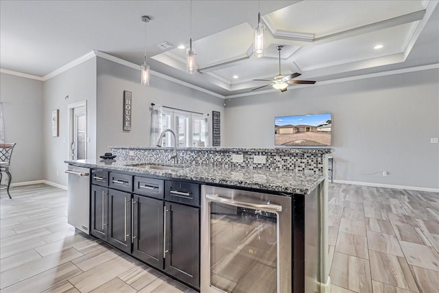 kitchen featuring beverage cooler, a sink, ornamental molding, coffered ceiling, and dishwasher