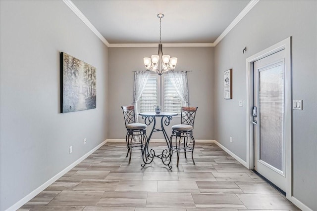 dining room with a chandelier, crown molding, baseboards, and light wood-style flooring