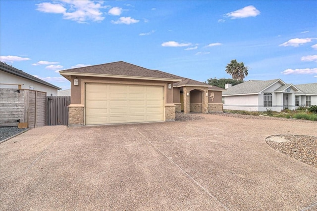 ranch-style house featuring driveway, stucco siding, stone siding, fence, and an attached garage