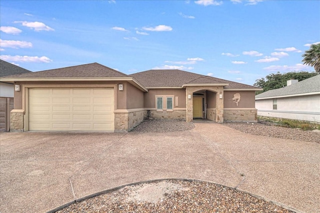 view of front facade with stone siding, concrete driveway, an attached garage, stucco siding, and a shingled roof