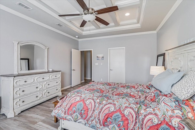 bedroom with coffered ceiling, crown molding, light wood-style floors, beam ceiling, and ceiling fan