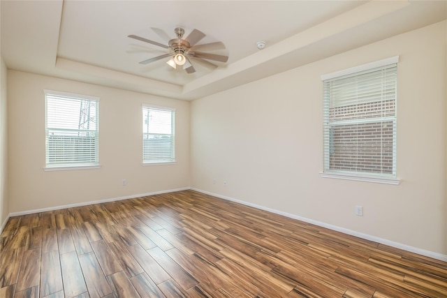 8919 Inglebrook Ln, Houston, TX 77083 - spare room featuring a raised ceiling, wood finished floors, baseboards, and a ceiling fan