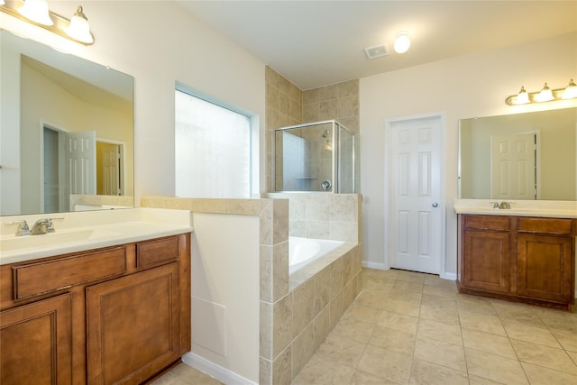 8919 Inglebrook Ln, Houston, TX 77083 - bathroom with a stall shower, a garden tub, two vanities, and tile patterned flooring