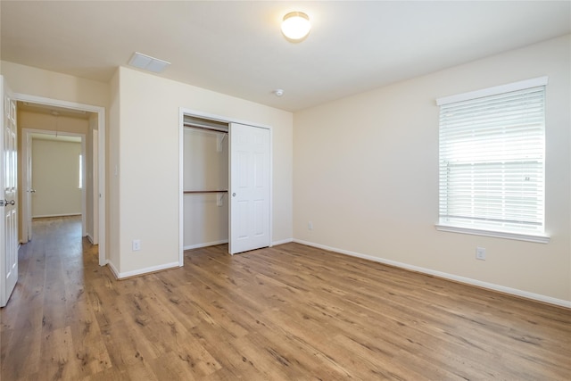 8919 Inglebrook Ln, Houston, TX 77083 - unfurnished bedroom with light wood-style floors, baseboards, and a closet