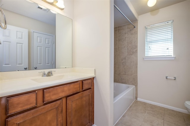 8919 Inglebrook Ln, Houston, TX 77083 - full bathroom featuring toilet, vanity, tile patterned flooring, baseboards, and shower / washtub combination