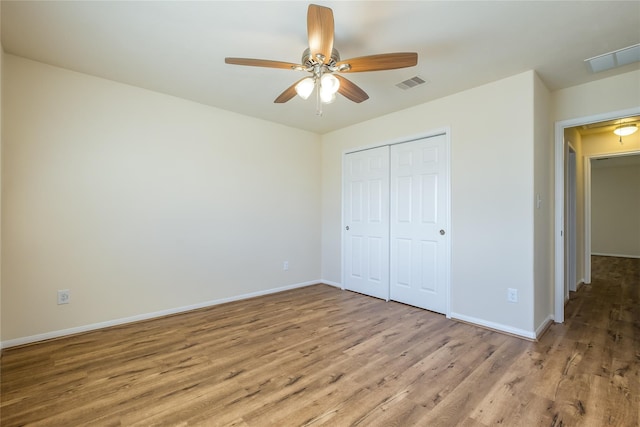 8919 Inglebrook Ln, Houston, TX 77083 - unfurnished bedroom featuring wood finished floors, baseboards, a closet, and a ceiling fan