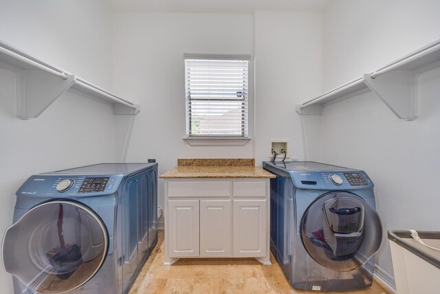 8606 Argentina St, Jersey Village, TX 77040 - laundry room with washer and dryer and cabinet space