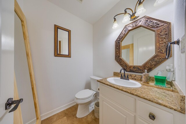 8606 Argentina St, Jersey Village, TX 77040 - bathroom featuring toilet, vanity, baseboards, and tile patterned floors