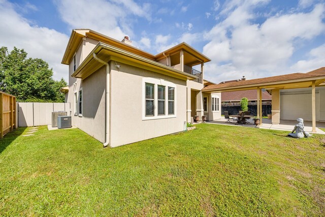 8606 Argentina St, Jersey Village, TX 77040 - rear view of property featuring a balcony, stucco siding, a patio, cooling unit, and a chimney