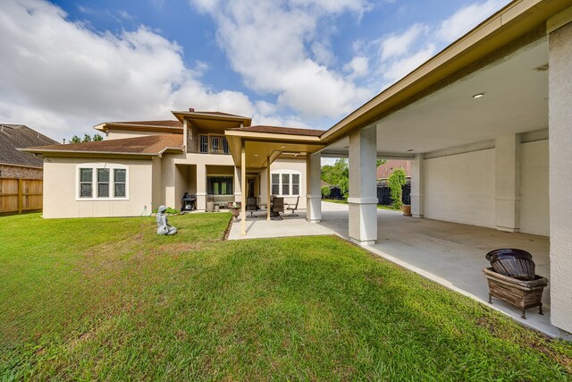 8606 Argentina St, Jersey Village, TX 77040 - rear view of house featuring a patio, a balcony, and stucco siding