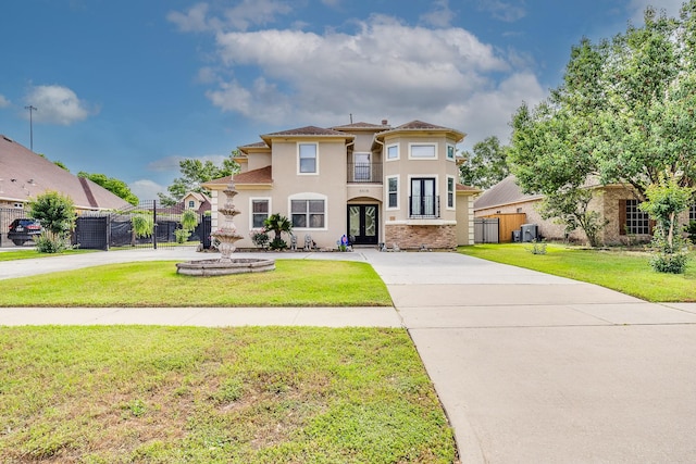 8606 Argentina St, Jersey Village, TX 77040 - mediterranean / spanish house featuring stucco siding, concrete driveway, and french doors