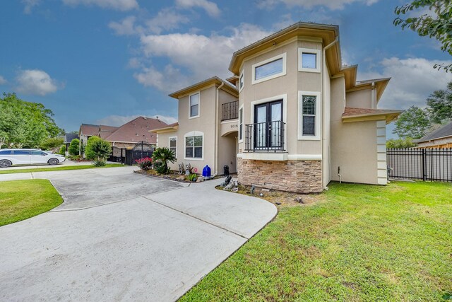 8606 Argentina St, Jersey Village, TX 77040 - view of front of house featuring stucco siding, driveway, and stone siding