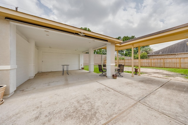 8606 Argentina St, Jersey Village, TX 77040 - view of patio / terrace featuring fence and a detached garage
