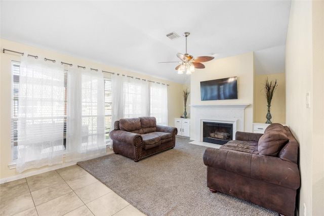 15703 W Astern Dr, Crosby, TX 77532 - living area with a fireplace with flush hearth, a ceiling fan, lofted ceiling, and light tile patterned floors