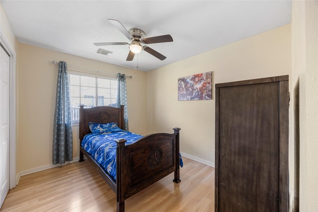 15703 W Astern Dr, Crosby, TX 77532 - bedroom featuring light wood-style flooring, baseboards, and a ceiling fan