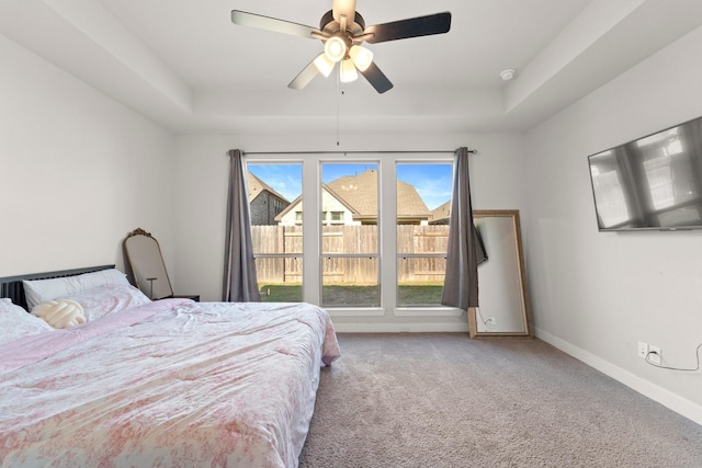 7010 Grassland Vista Ln, Katy, TX 77493 - bedroom with a tray ceiling, carpet floors, and ceiling fan