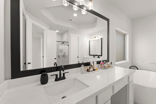 7010 Grassland Vista Ln, Katy, TX 77493 - full bathroom with a tub, vanity, a shower stall, and a raised ceiling