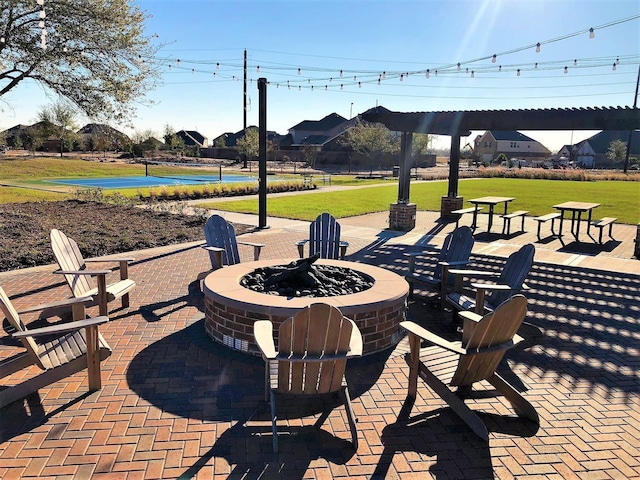7010 Grassland Vista Ln, Katy, TX 77493 - view of patio / terrace with an outdoor fire pit
