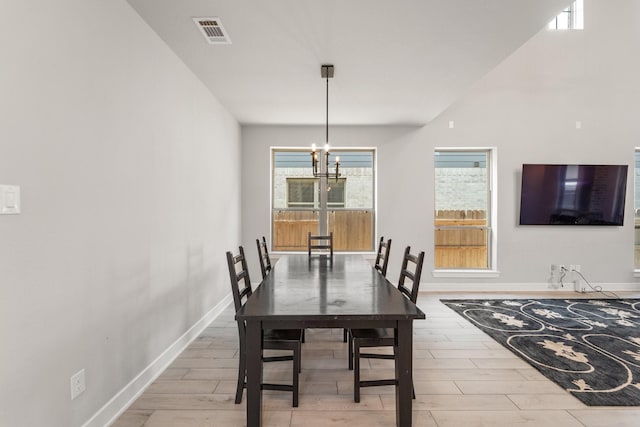 7010 Grassland Vista Ln, Katy, TX 77493 - dining space featuring a chandelier and wood finished floors