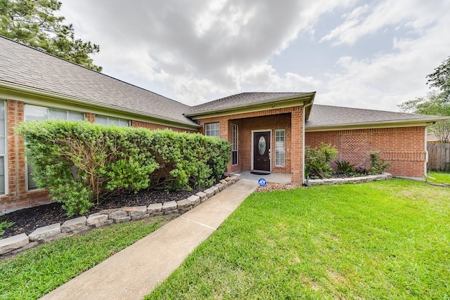3610 Banks Run Ln, Katy, TX 77449 - view of front of property with brick siding, a front lawn, and a shingled roof