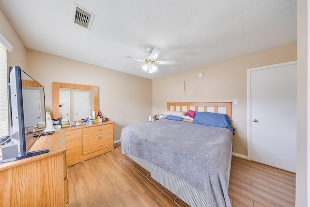 3610 Banks Run Ln, Katy, TX 77449 - bedroom featuring light wood-type flooring, ceiling fan, and baseboards
