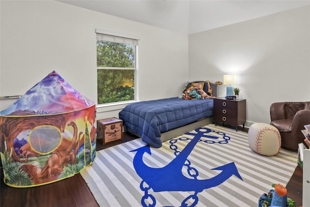 bedroom featuring wood finished floors