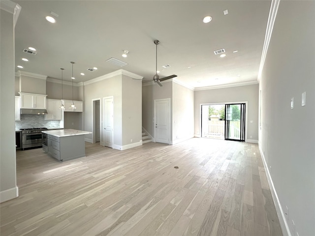 2616 Lake Kolbe Ln, Houston, TX 77080 - unfurnished living room with recessed lighting, baseboards, stairway, light wood-style flooring, and ornamental molding