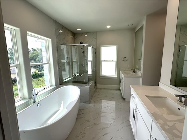 2616 Lake Kolbe Ln, Houston, TX 77080 - bathroom featuring marble look tile flooring, a marble finish shower, two vanities, recessed lighting, and a freestanding bath