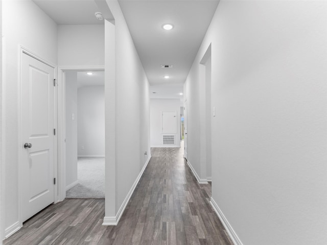 2715 Marguerite St, Bay City, TX 77414 - hall with dark wood-style flooring, baseboards, and recessed lighting